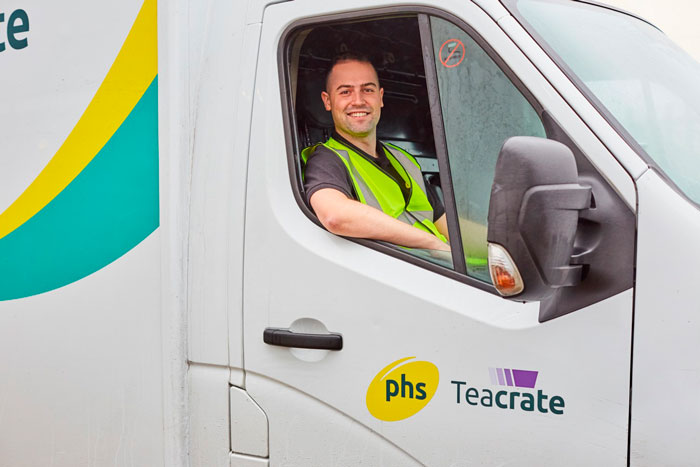Image of workman driving a phs Teacrate van