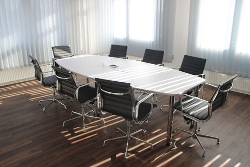 Chairs around a table in an empty office