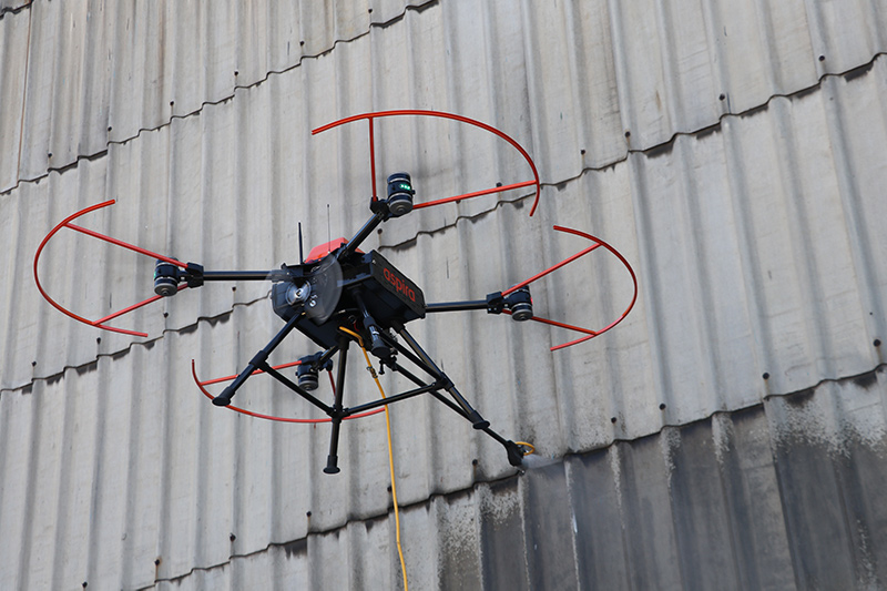 Aspira drone applying a specialist nano titanium coating to a building's fascia