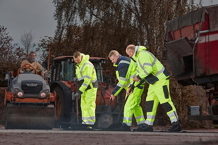 A roadwork crew wearing high-vis PPE clothing