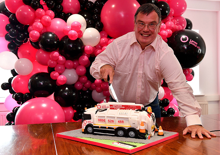 Happy 30th Anniversary - Lanes Group Chief Executive Wayne Earnshaw cuts jet vac tanker cake at Manchester HQ