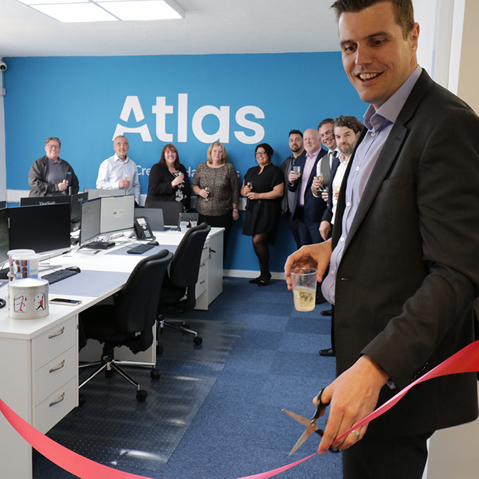 Gary Stanton, Managing Director at Atlas Security, cutting the ribbon at the opening ceremony