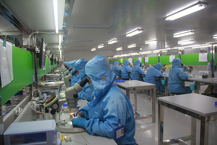 Pharmaceutical workers in a clean room